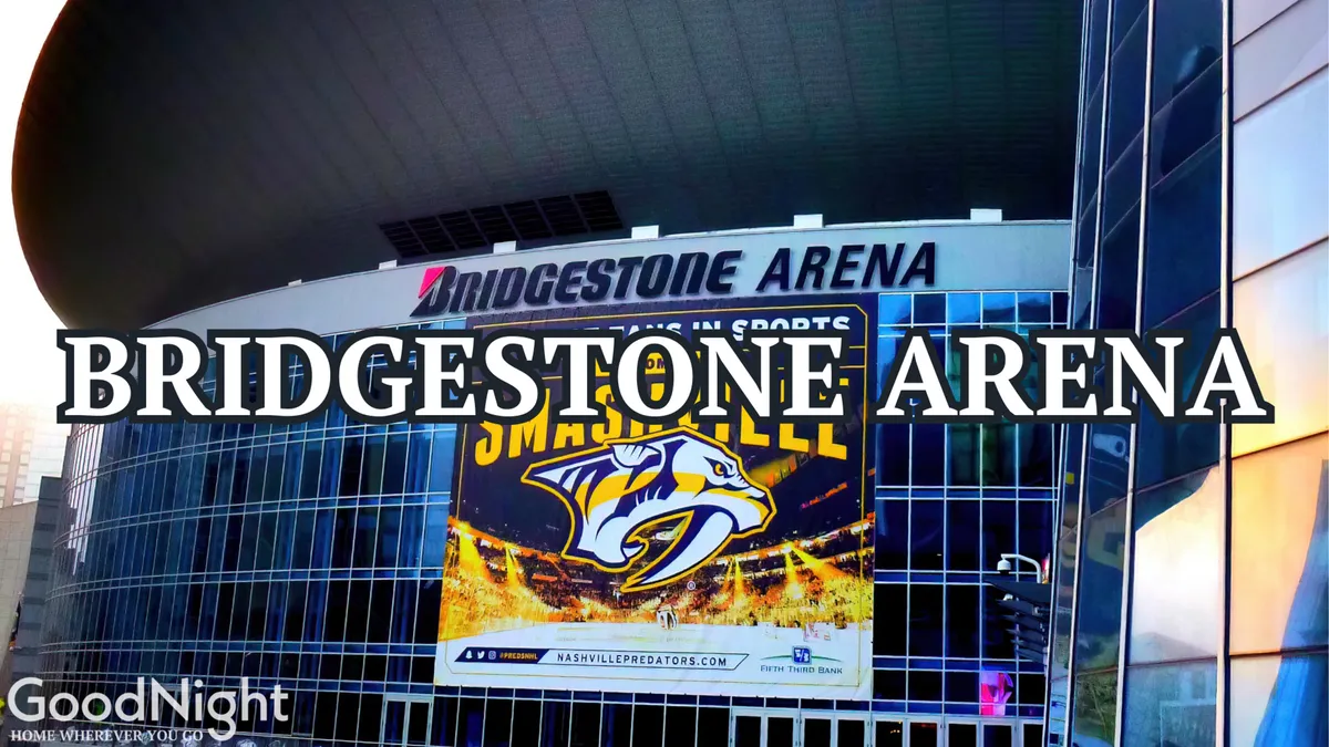 A dynamic view showing the Bridgestone Arena with its clear signage and banners, set against modern architectural lines. The scene anticipates crowds gathering for concerts, live shows, and major events, highlighting one of Nashville’s most famous entertainment venues.
