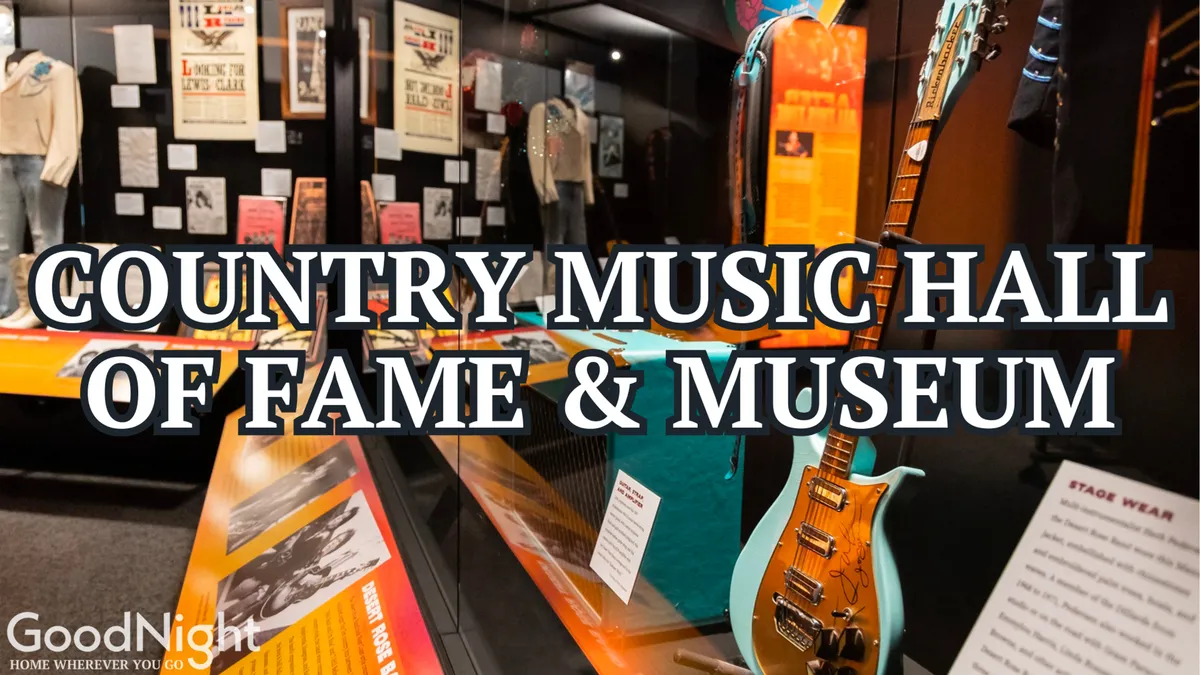 This interior museum scene displays a guitar, stage wear, and clear museum signage, indicating the Country Music Hall of Fame or a similar iconic Nashville music attraction. The exhibits are engaging, inviting families and children to immerse themselves in Nashville’s musical heritage through artifacts and interactive learning.